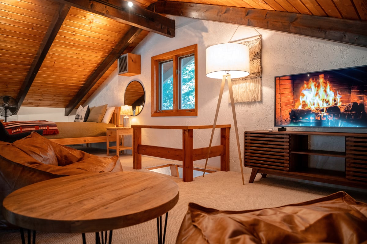 Bright sunny loft with sitting area, Frame TV, and queen bed